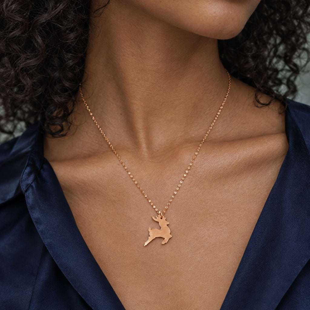 Model wearing the Lesunja Little Christmas Red Reindeer Necklace by Lesunja Fine Jewellery – AI-generated visualisation