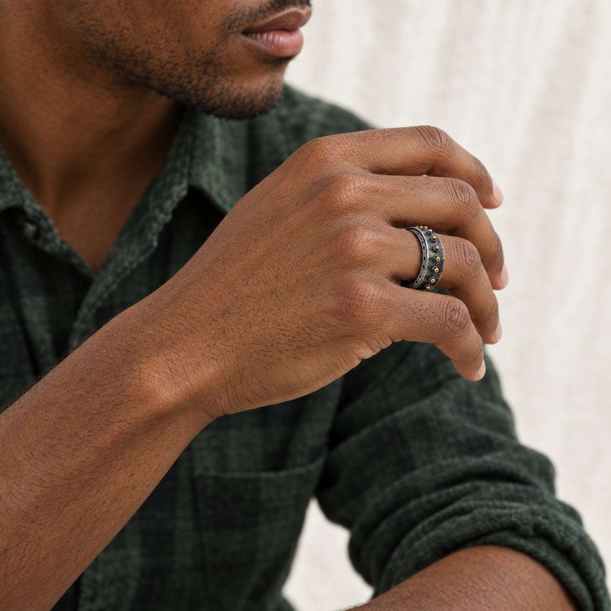 Model wearing the Lesunja Knight Arthur Blackened Silver Ring by Lesunja Fine Jewellery – AI-generated visualisation