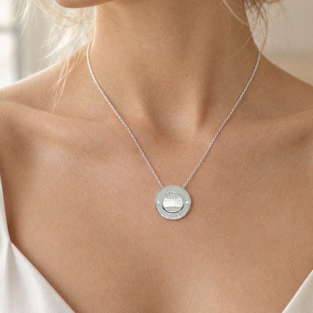 Model wearing the Lesunja Little Christmas Tree Ball Silver Pendant for Bracelet by Lesunja Fine Jewellery – AI-generated visualisation