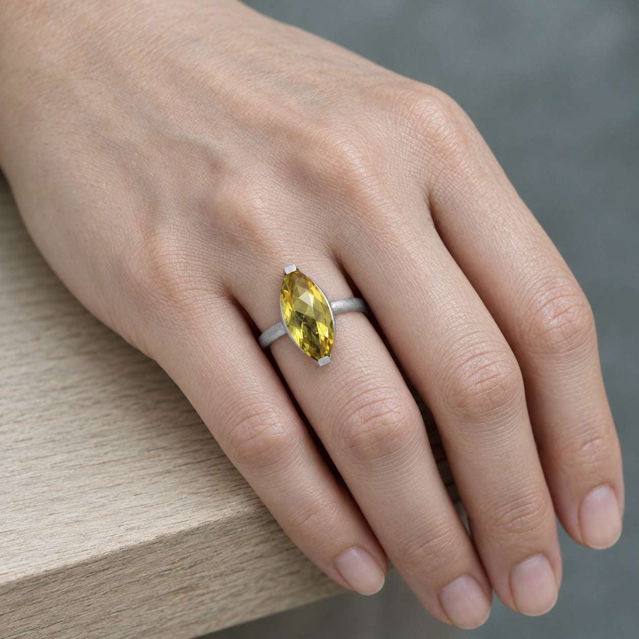 Model wearing the Lesunja Ring Platinum Goldberyll by Lesunja Fine Jewellery – AI-generated visualisation