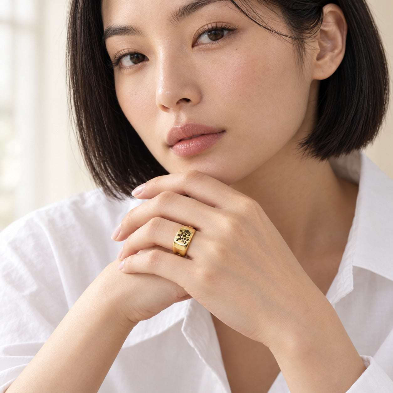 Model wearing the Lesunja Zodiac Steel Gemini Yellow Gold Plated Ring by Lesunja Fine Jewellery – AI-generated visualisation