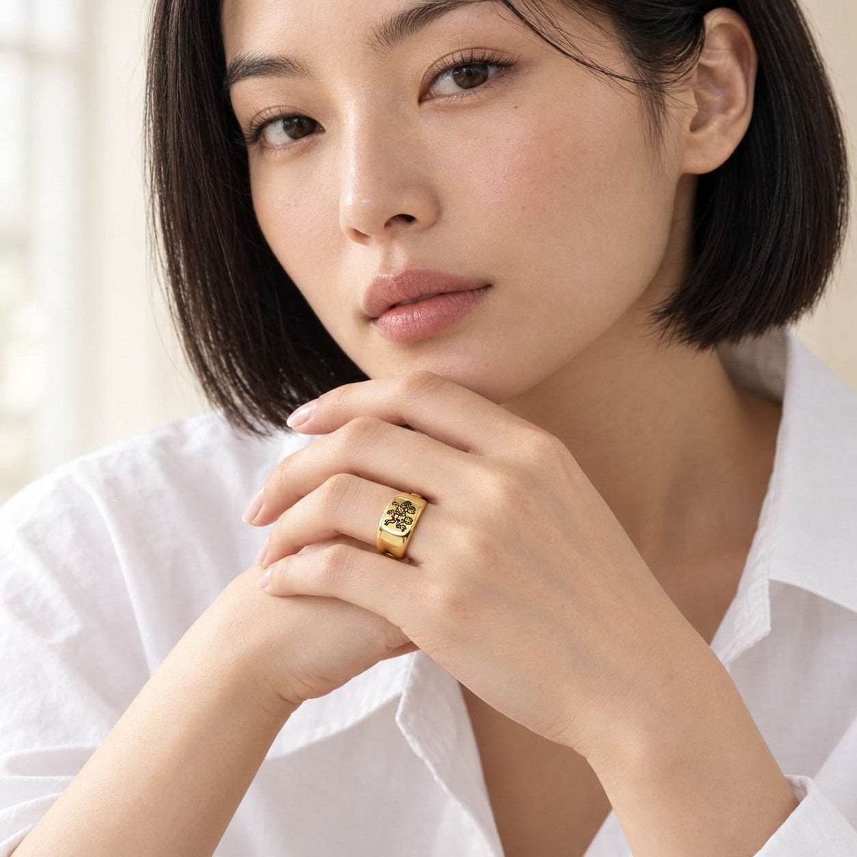 Model wearing the Lesunja Zodiac Steel Gemini Yellow Gold Plated Ring by Lesunja Fine Jewellery – AI-generated visualisation