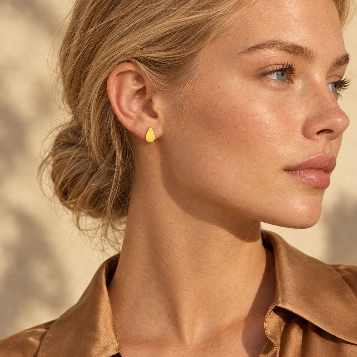 Model wearing the Lesunja Je Veux Yellow Gold Stud Earrings by Lesunja Fine Jewellery – AI-generated visualisation