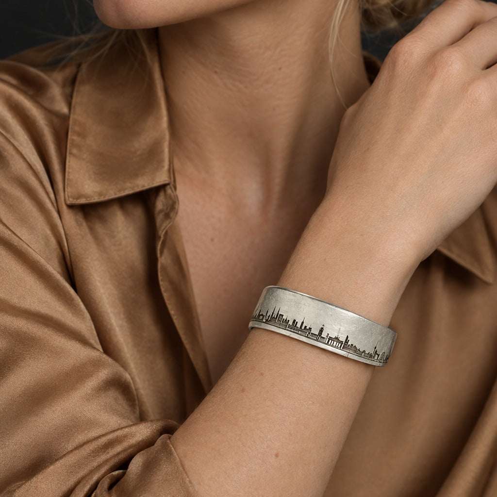 Model wearing the The World Skyline Bangle Silver 925 by Lesunja Fine Jewellery – AI-generated visualisation