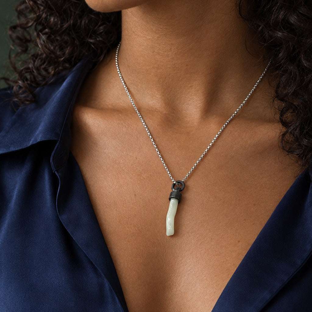 Model wearing the Lesunja Silver Coral Pendant by Lesunja Fine Jewellery – AI-generated visualisation