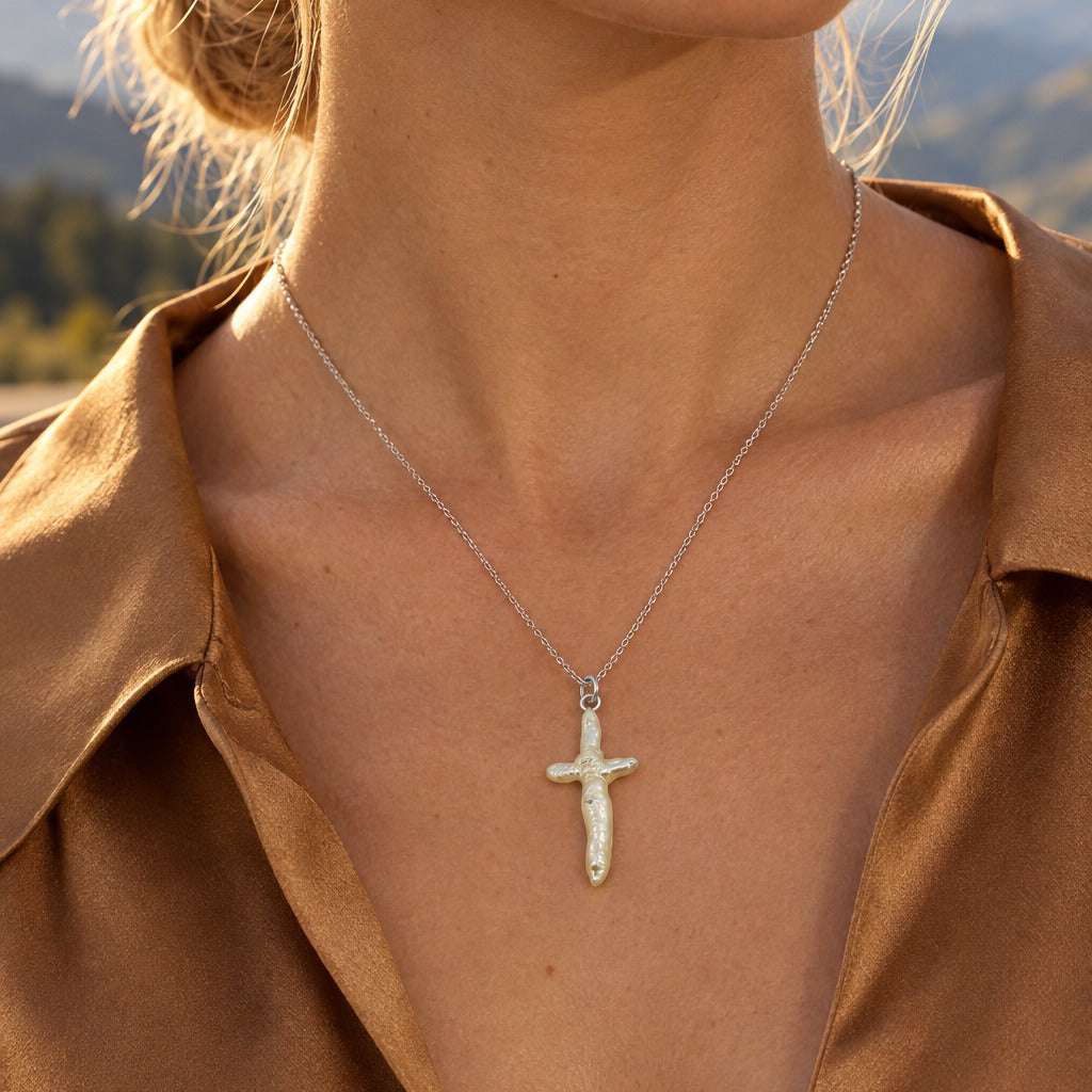 Model wearing the Lesunja Pearl Cross Silver Pendant by Lesunja Fine Jewellery – AI-generated visualisation