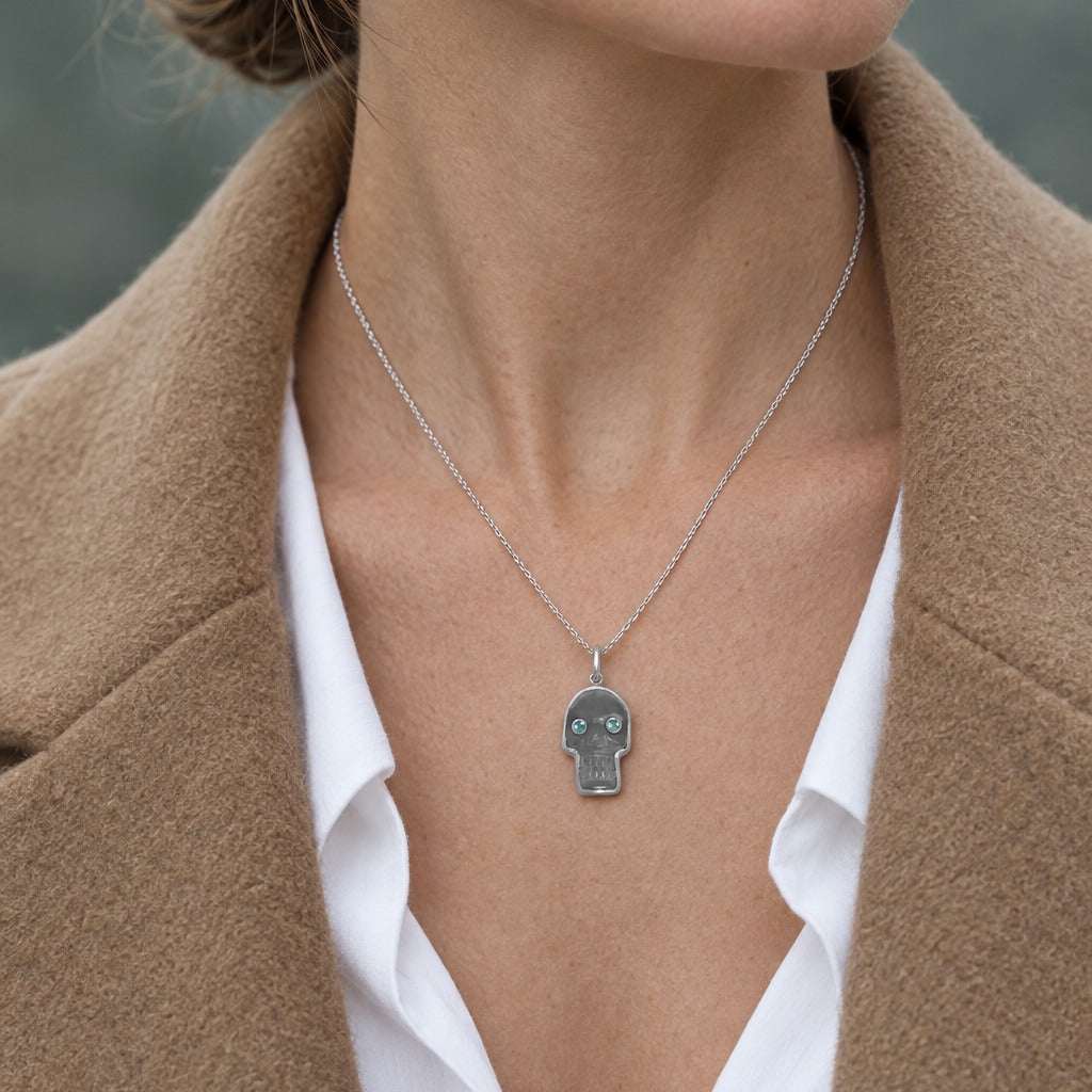 Model wearing the Lesunja 925 Aquamarine Sterling Silver Skull Pendant by Lesunja Fine Jewellery – AI-generated visualisation