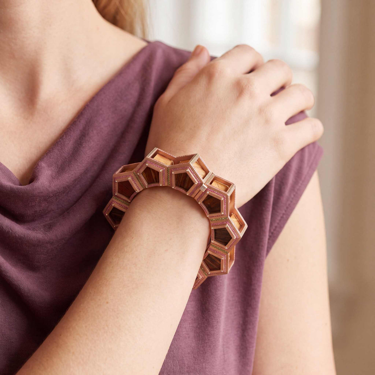 Model wearing the Lesunja Red Tower Engadin Bangle