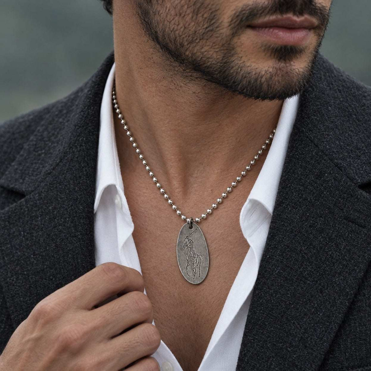 Model wearing the Lesunja Poloplayer Blackened Silver Necklace by Lesunja Fine Jewellery – AI-generated visualisation