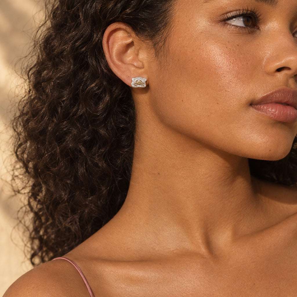 Model wearing the Lesunja Zodiac Cancer Silver Earrings by Lesunja Fine Jewellery – AI-generated visualisation