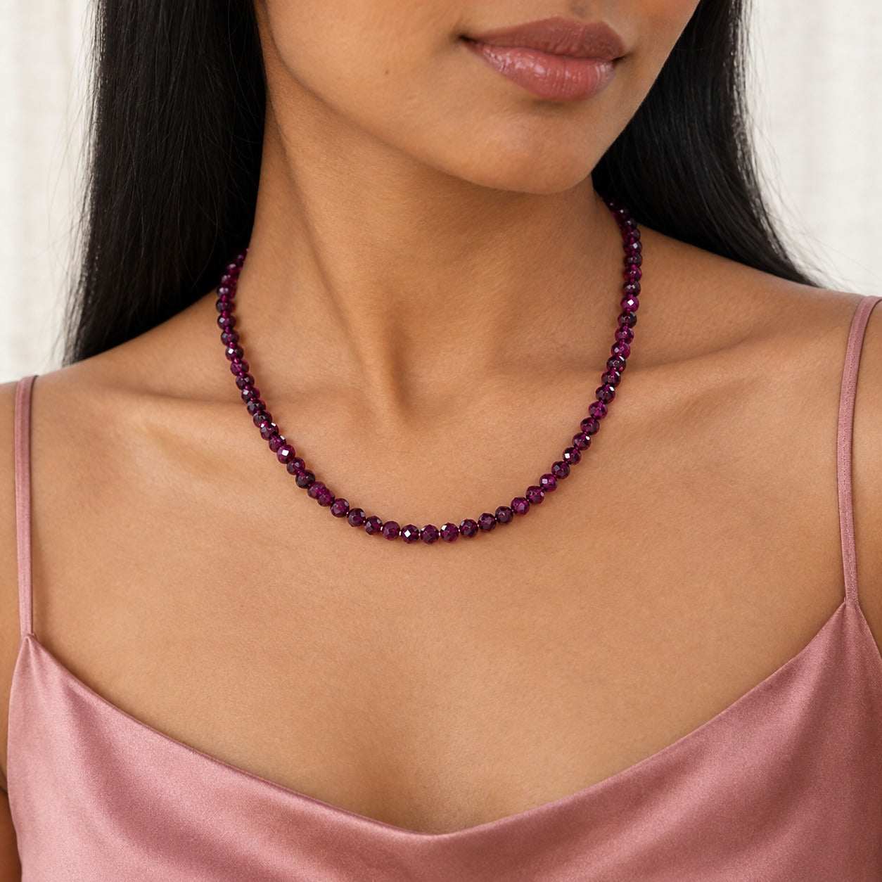 Model wearing the Lesunja Red Rose Rhodolit Stone Necklace by Lesunja Fine Jewellery – AI-generated visualisation