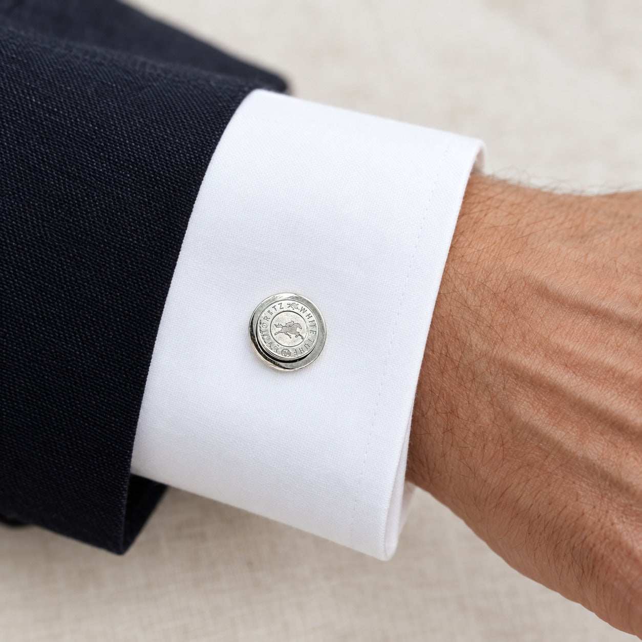 Model wearing the Lesunja St. Moritz White Turf Cufflinks by Lesunja Fine Jewellery – AI-generated visualisation
