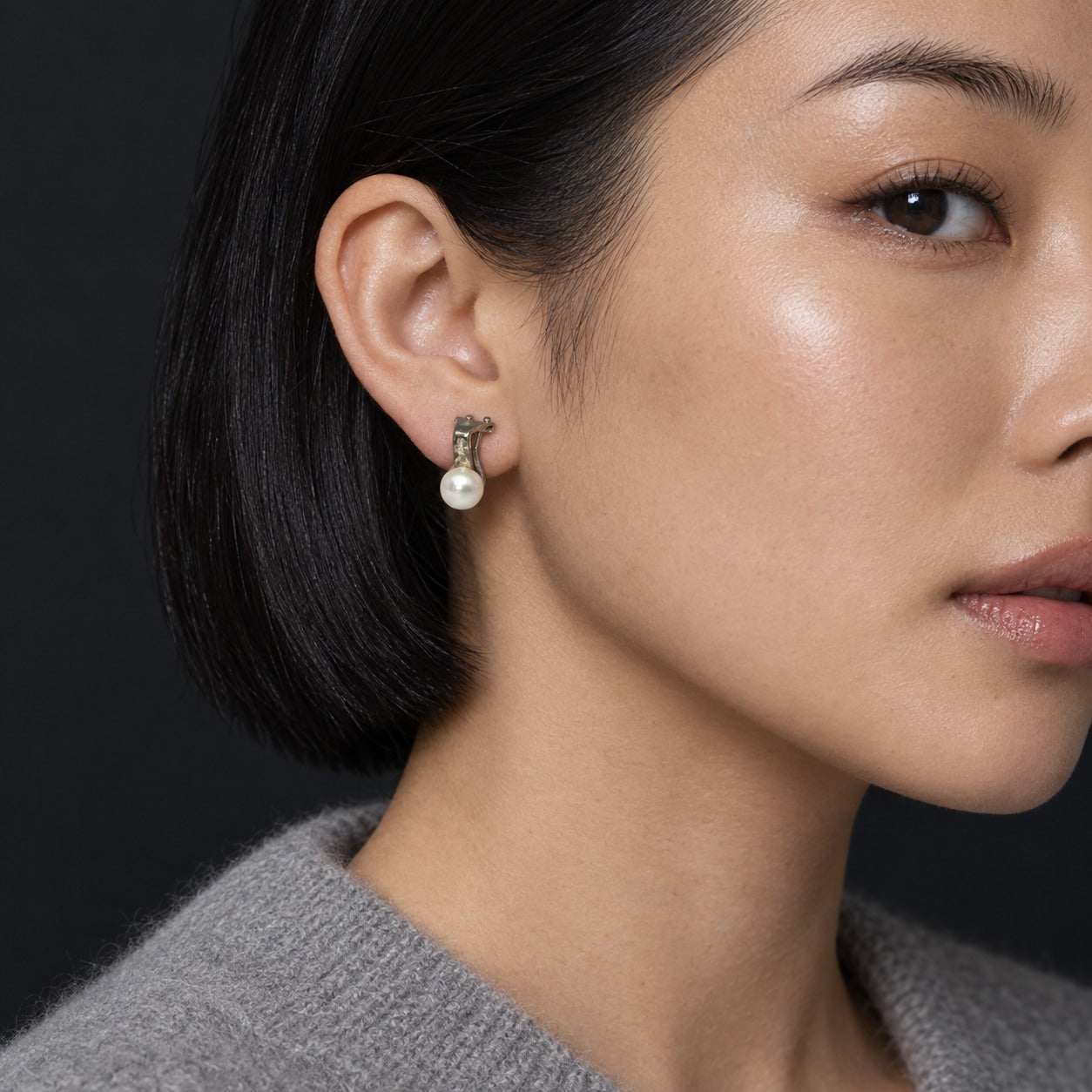Model wearing the Lesunja Silver and Freshwater Pearl Earrings by Lesunja Fine Jewellery – AI-generated visualisation