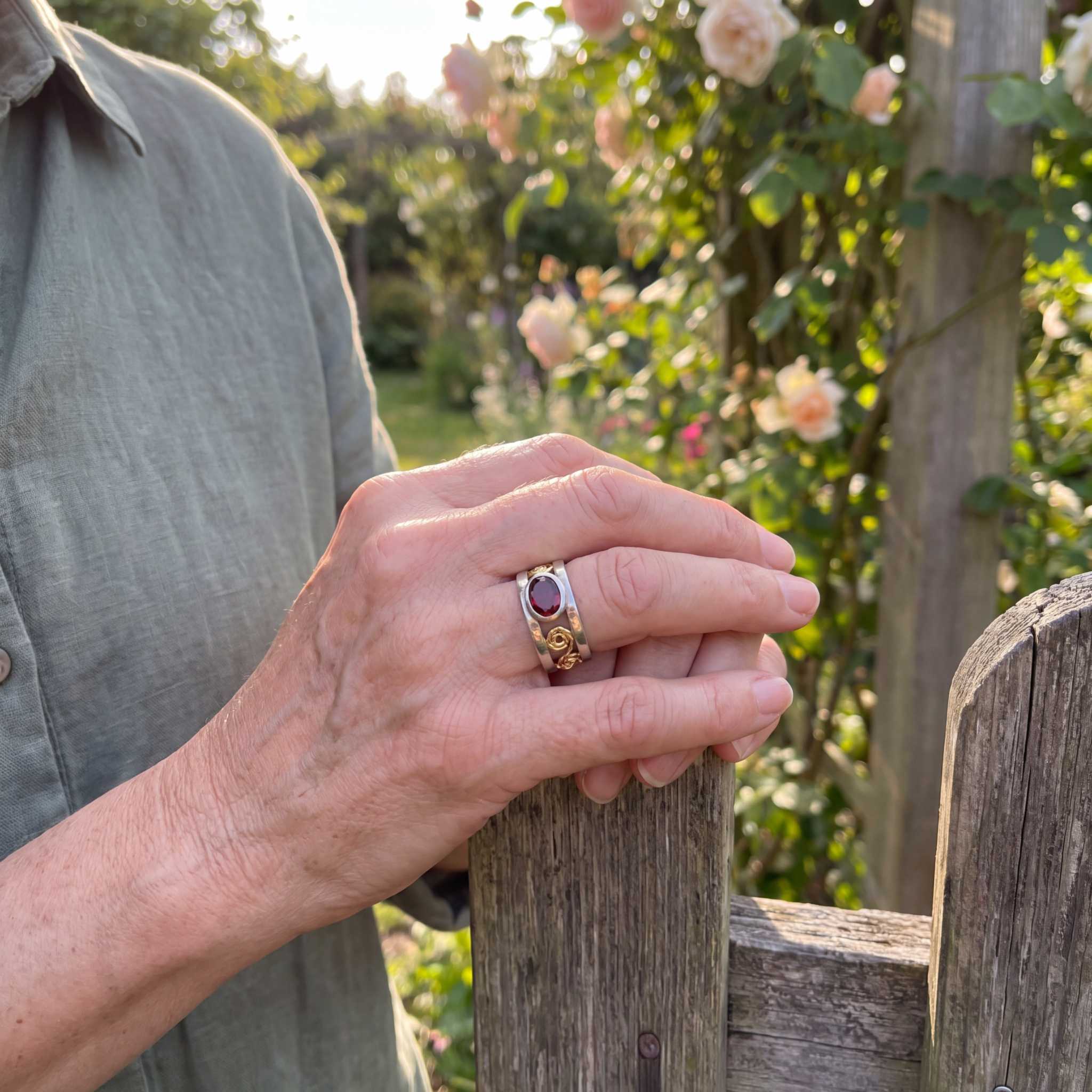 Model wearing the Lesunja Filigree White & Yellow Gold Ring Garnet