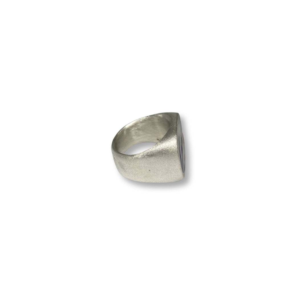 Lesunja silver signet ring with blue anchor and red heart enamel design, side view.