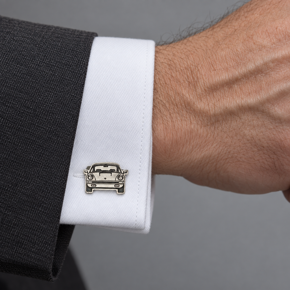 Model wearing the Lesunja cufflinks silver Porsche engraving