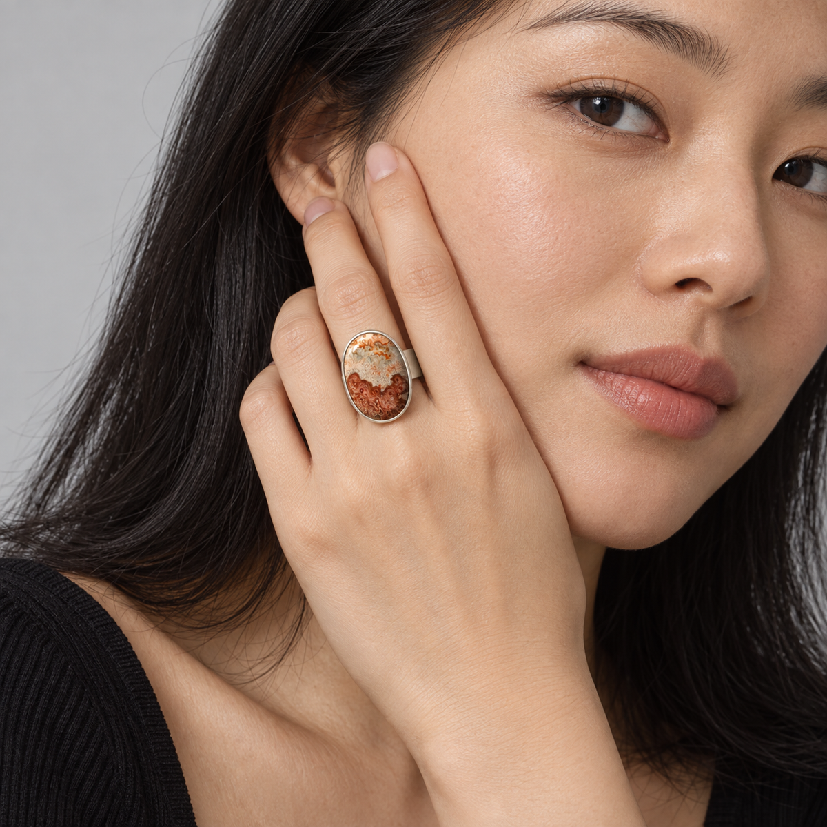 Model wearing the Lesunja Silver Agate Ring Red and Cream Cabochon Size 62
