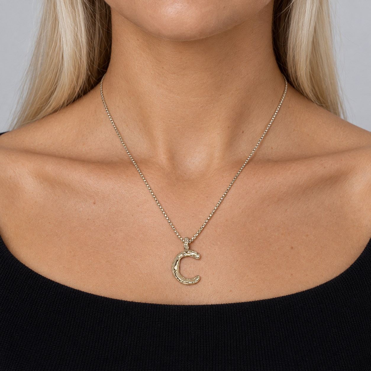 Model wearing the Lesunja Silver Letter C Necklace