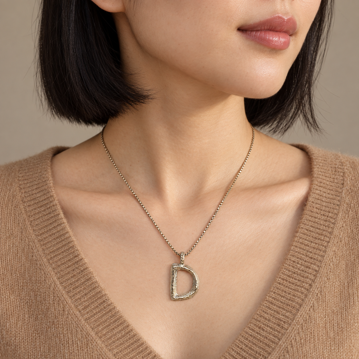 Model wearing the Lesunja Silver Letter D Necklace