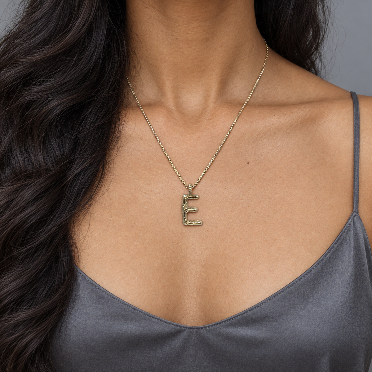 Model wearing the Lesunja Silver Letter E Necklace