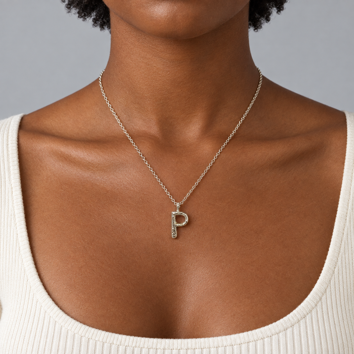 Model wearing the Lesunja Silver Letter P Necklace