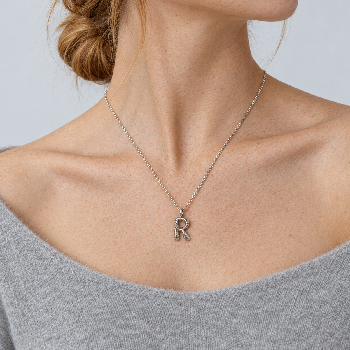 Model wearing the Lesunja Silver Letter R Necklace