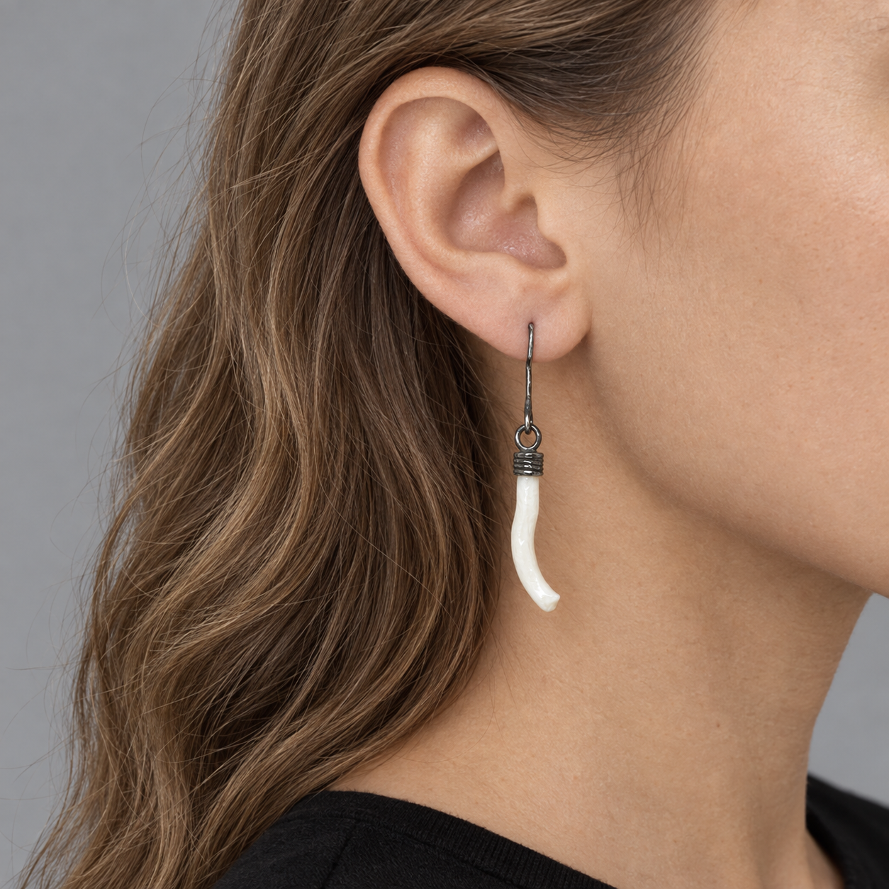 Model wearing the Lesunja Sweet White Coral Silver Hangers