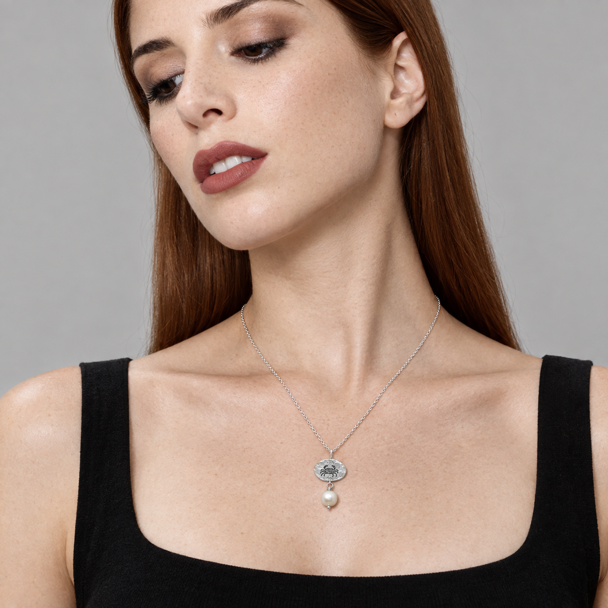 Model wearing the Lesunja Zodiac Cancer Silver Necklace Freshwater Pearl