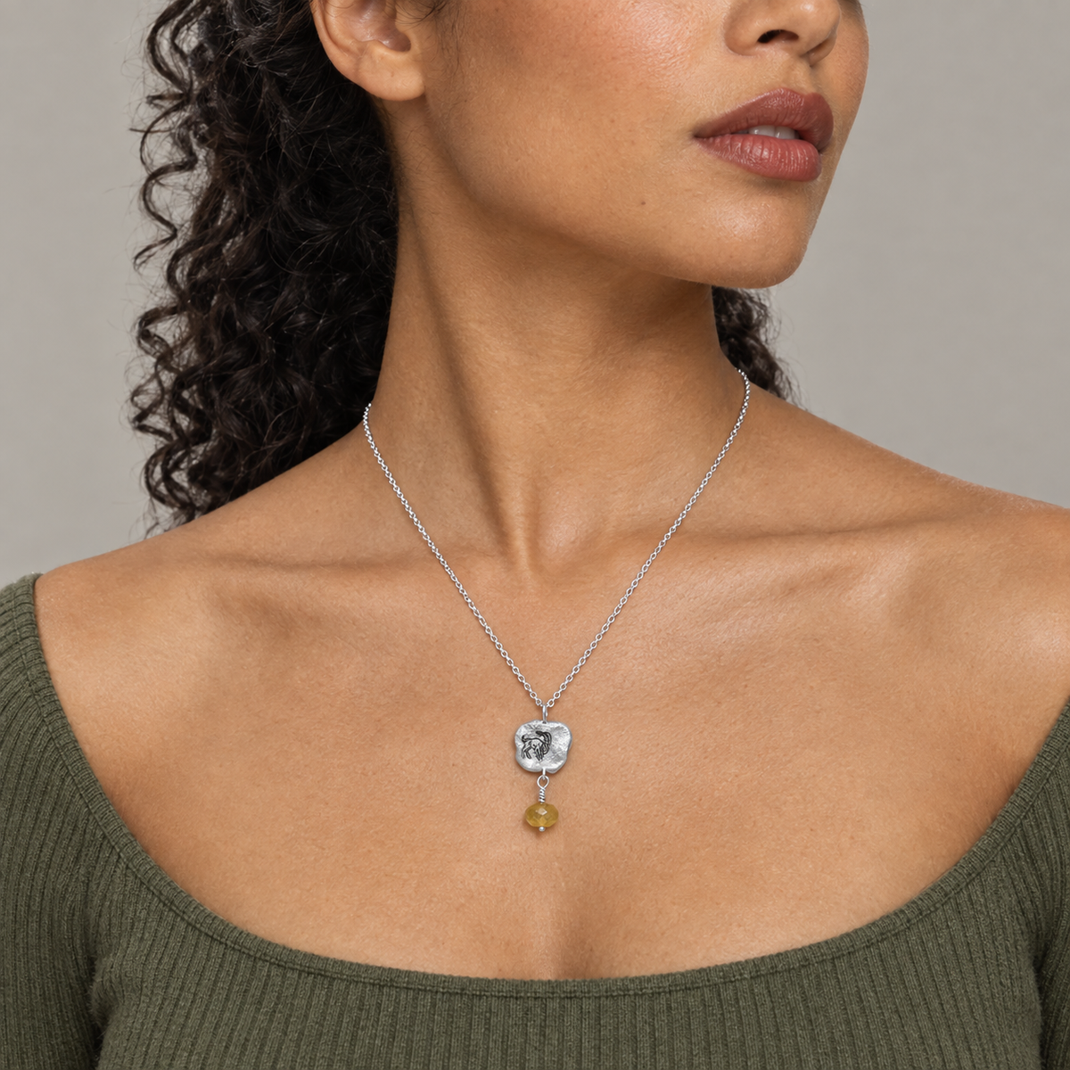 Model wearing the Lesunja Zodiac Capricorn Silver Necklace