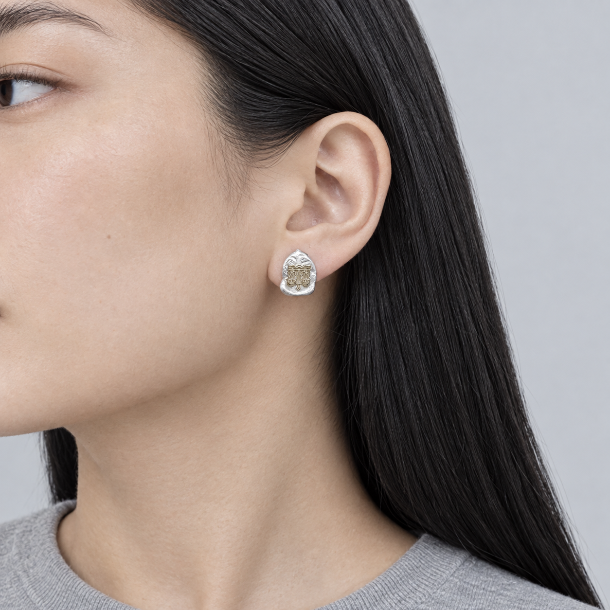 Model wearing the Lesunja Zodiac Libra Silver Earrings