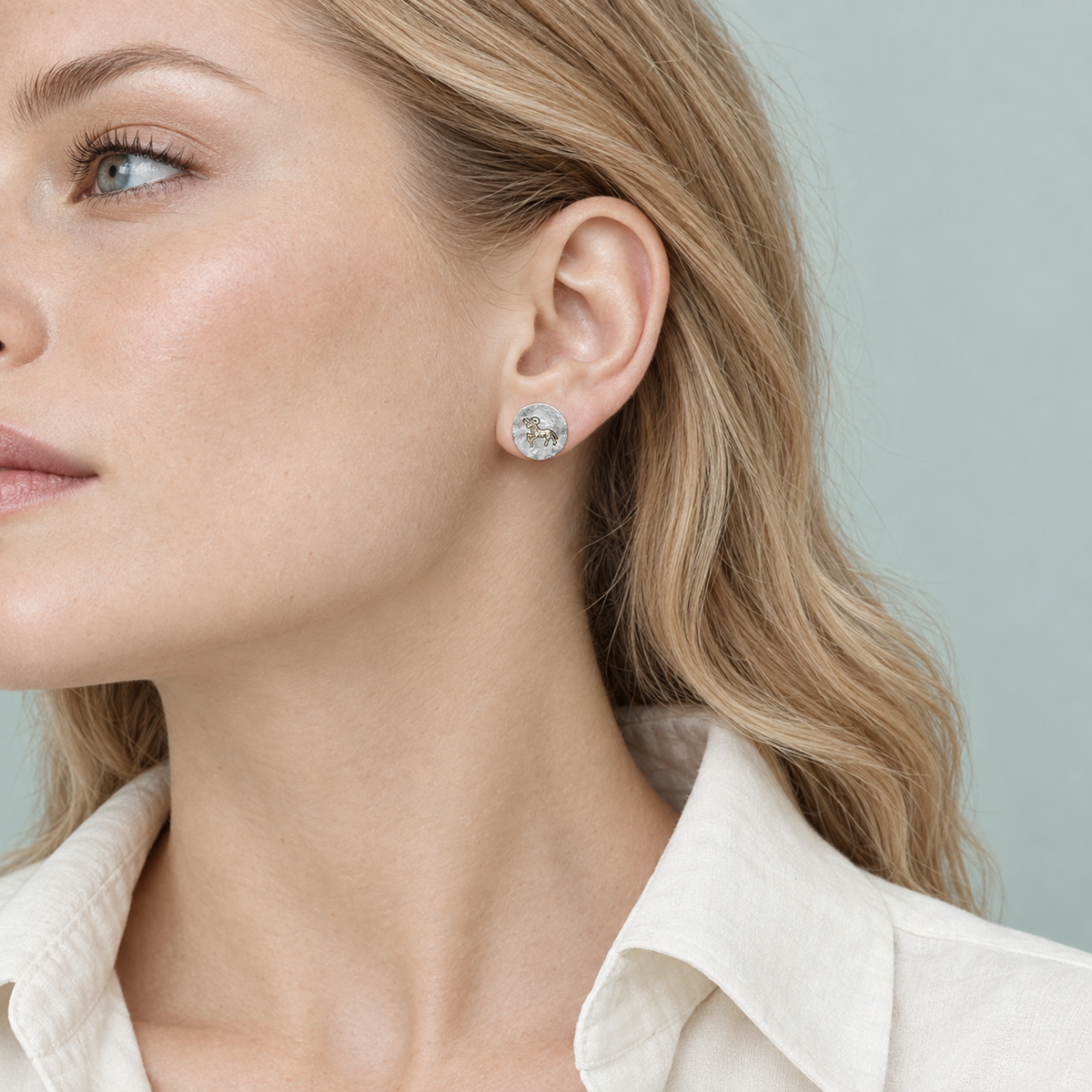 Model wearing the Lesunja Zodiac Aries Silver Earrings