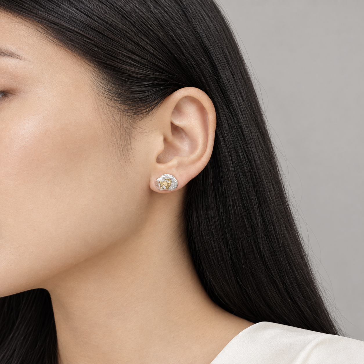 Model wearing the Lesunja Zodiac Capricorn Silver Earrings