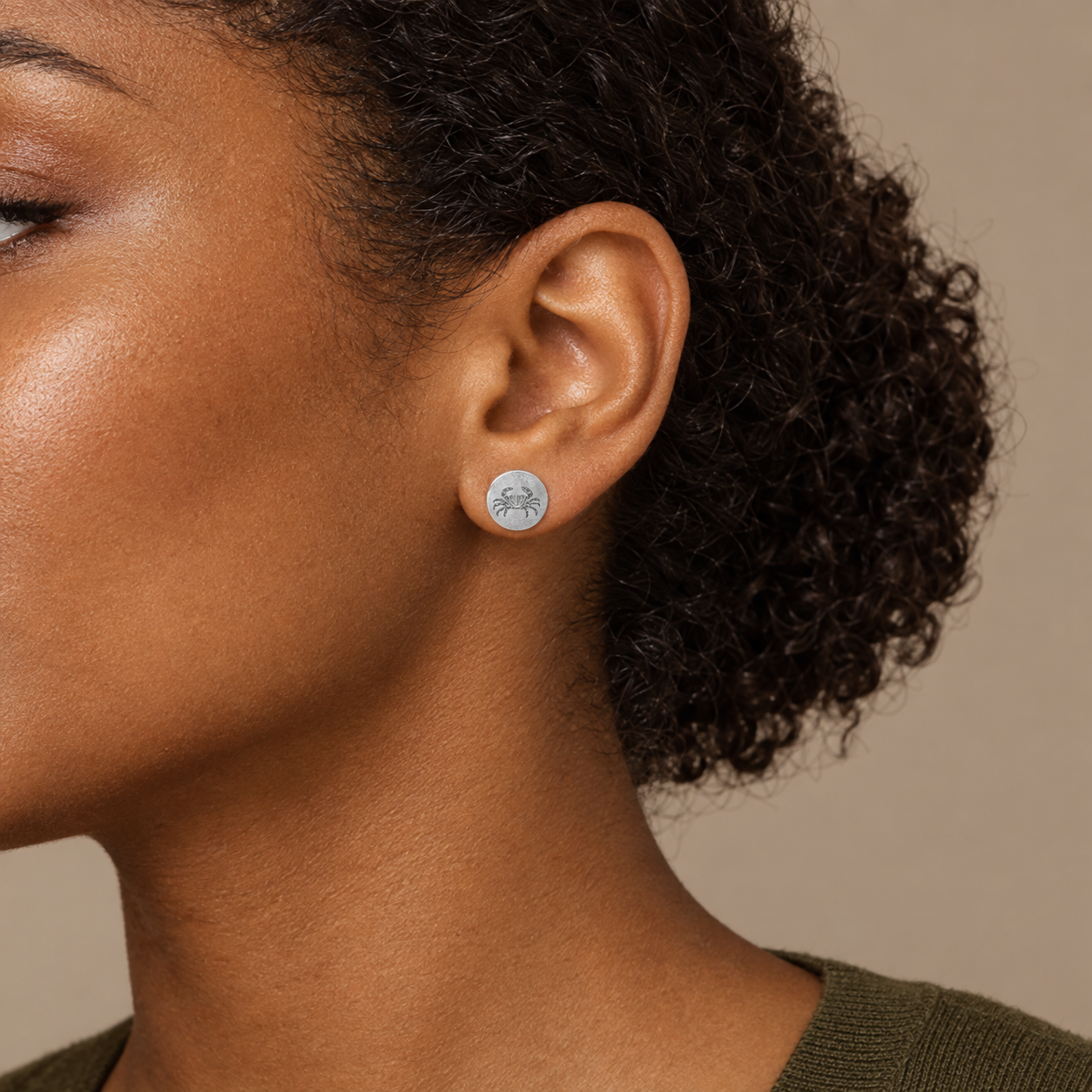 Model wearing the Lesunja Zodiac Cancer Silver Ear Studs