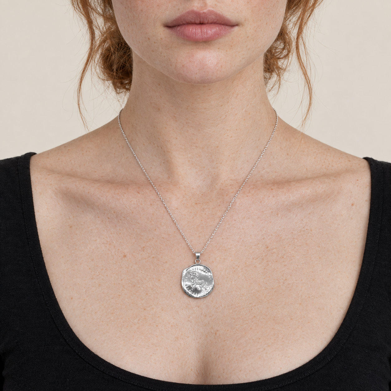 Model wearing the Lesunja Zodiac Aries Silver Necklace