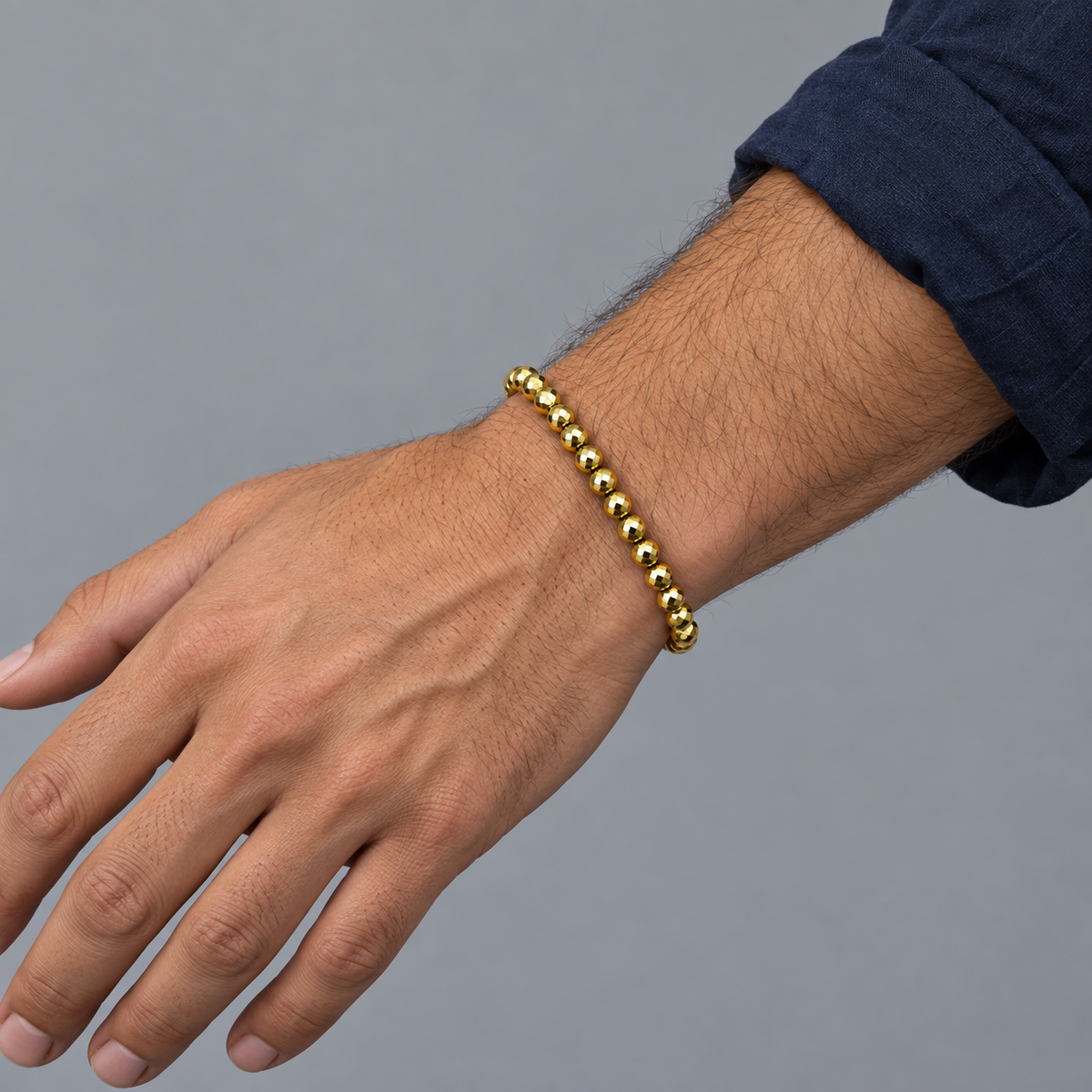 Model wearing the Lesunja Hematite Yellow Gold Plated Bracelet thick