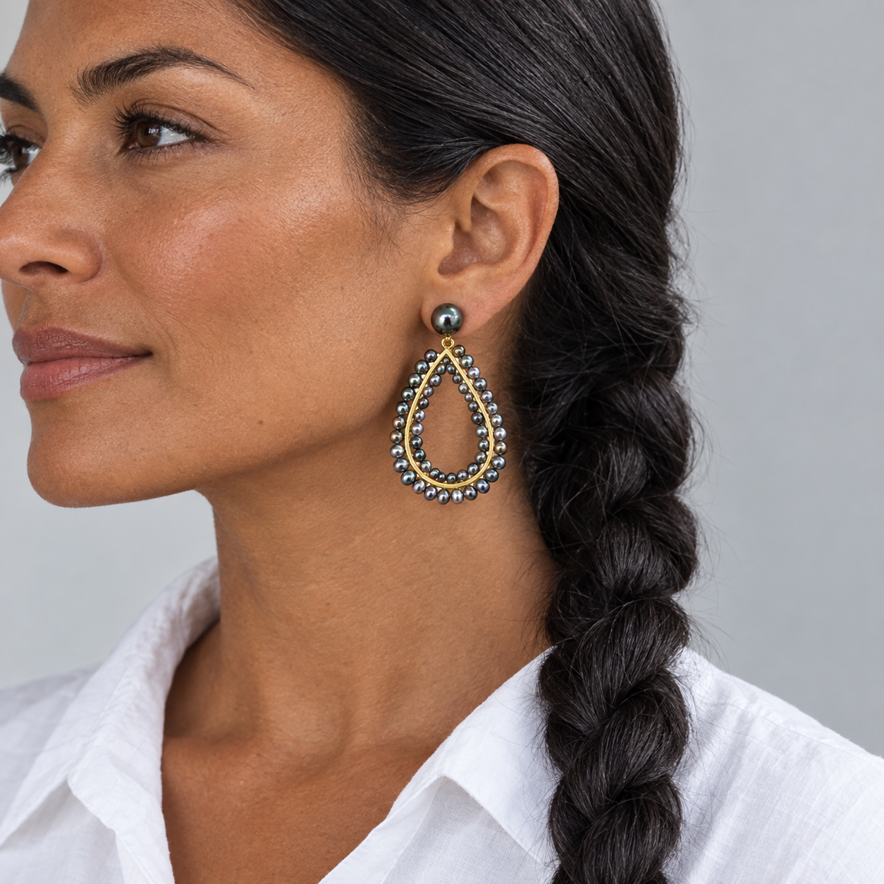 Model wearing the Lesunja Jet Set St. Tropez Ear Studs Chandlers Yellow Gold Tahiti Pearls