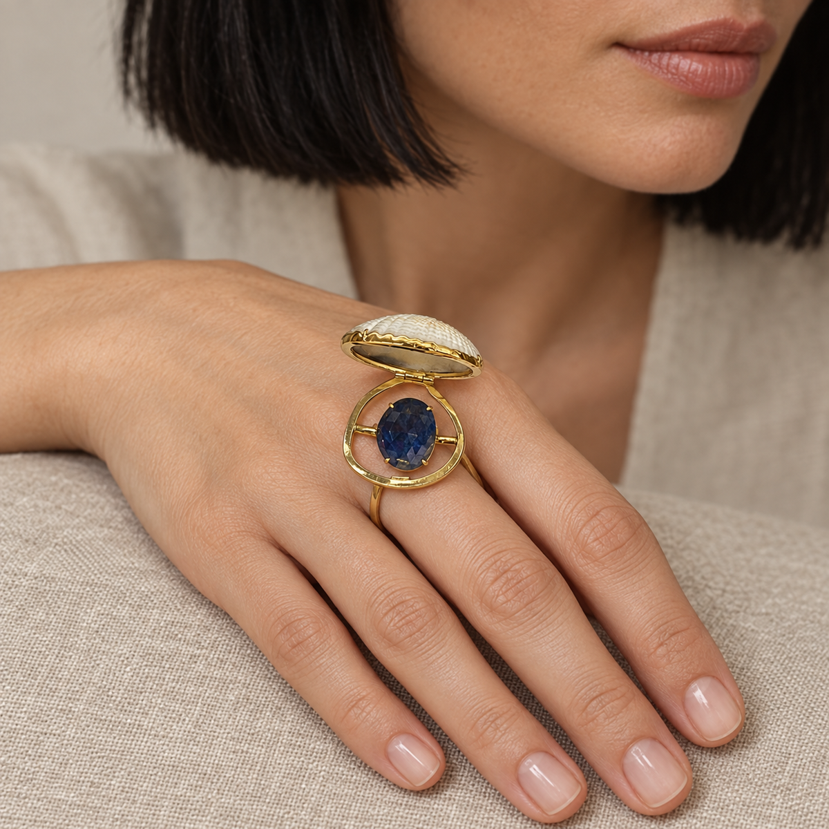 Model wearing the Lesunja Ocean XXY Boho Cocktail Ring Yellow Gold Blue Sapphire Shell