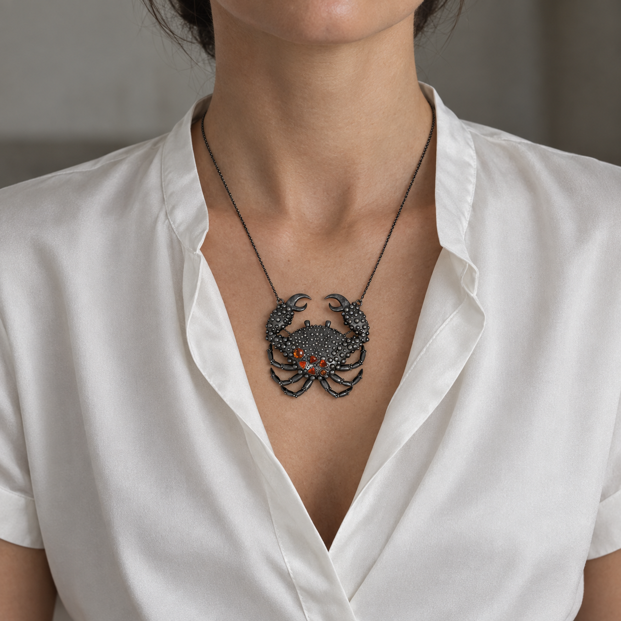 Model wearing the Lesunja Ocean Big Crab Opal Blackened Silver Necklace