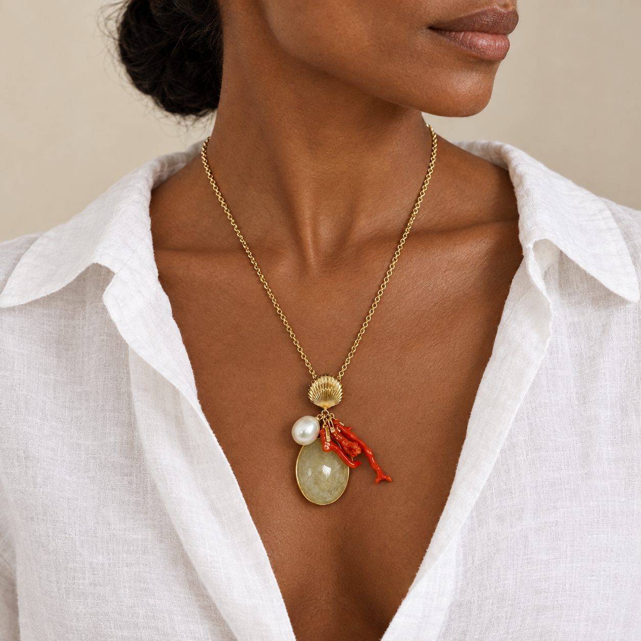 Model wearing the Lesunja Ocean XXY Boho La Vie Necklace Yellow Gold Sapphire Coral Pearl