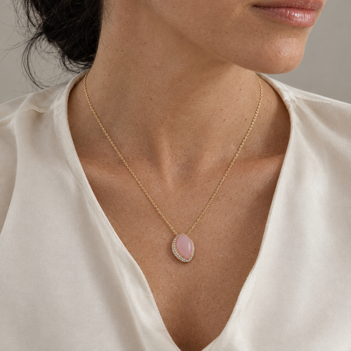 Model wearing the Lesunja Jet Set San Francisco Rose Gold Pendant