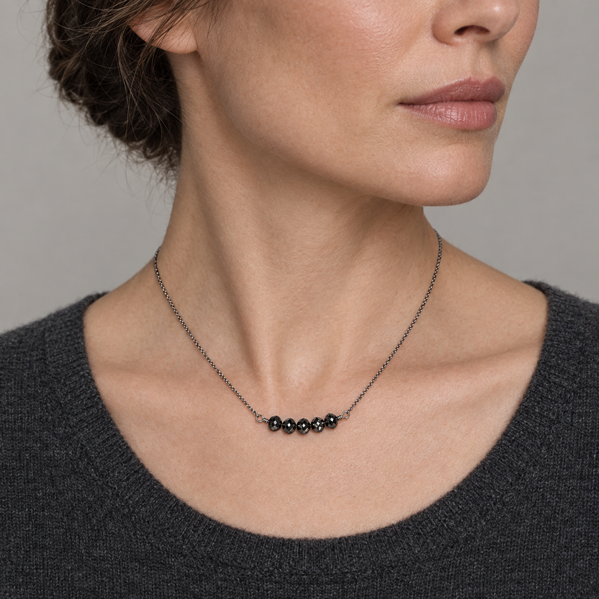 Model wearing the Lesunja Necklace White Gold Black Diamonds