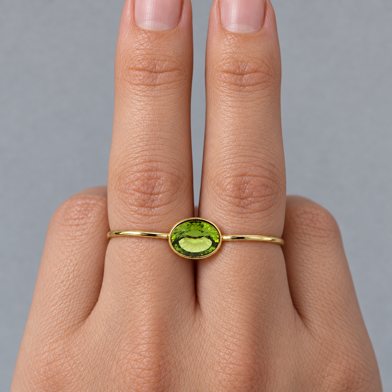 Model wearing the Lesunja Double Ring Yellow Gold Peridot