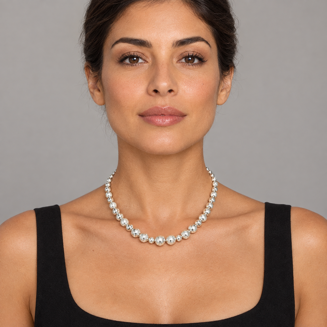 Model wearing the Lesunja Sepia Silver Bubble Necklace