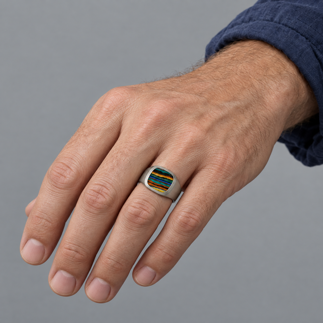 Model wearing the Lesunja Signet Ring Palladium With Rainbow Chrysocolla