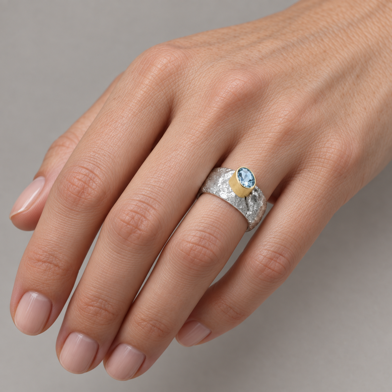 Model wearing the Lesunja Contemporary Mojo Aquamarine Silver Yellow Gold Rings