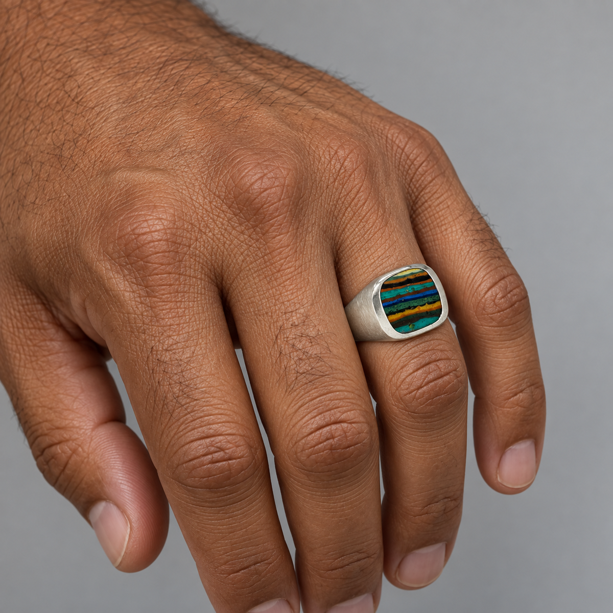 Model wearing the Lesunja Signet Ring Silver With Rainbow Chrysocolla