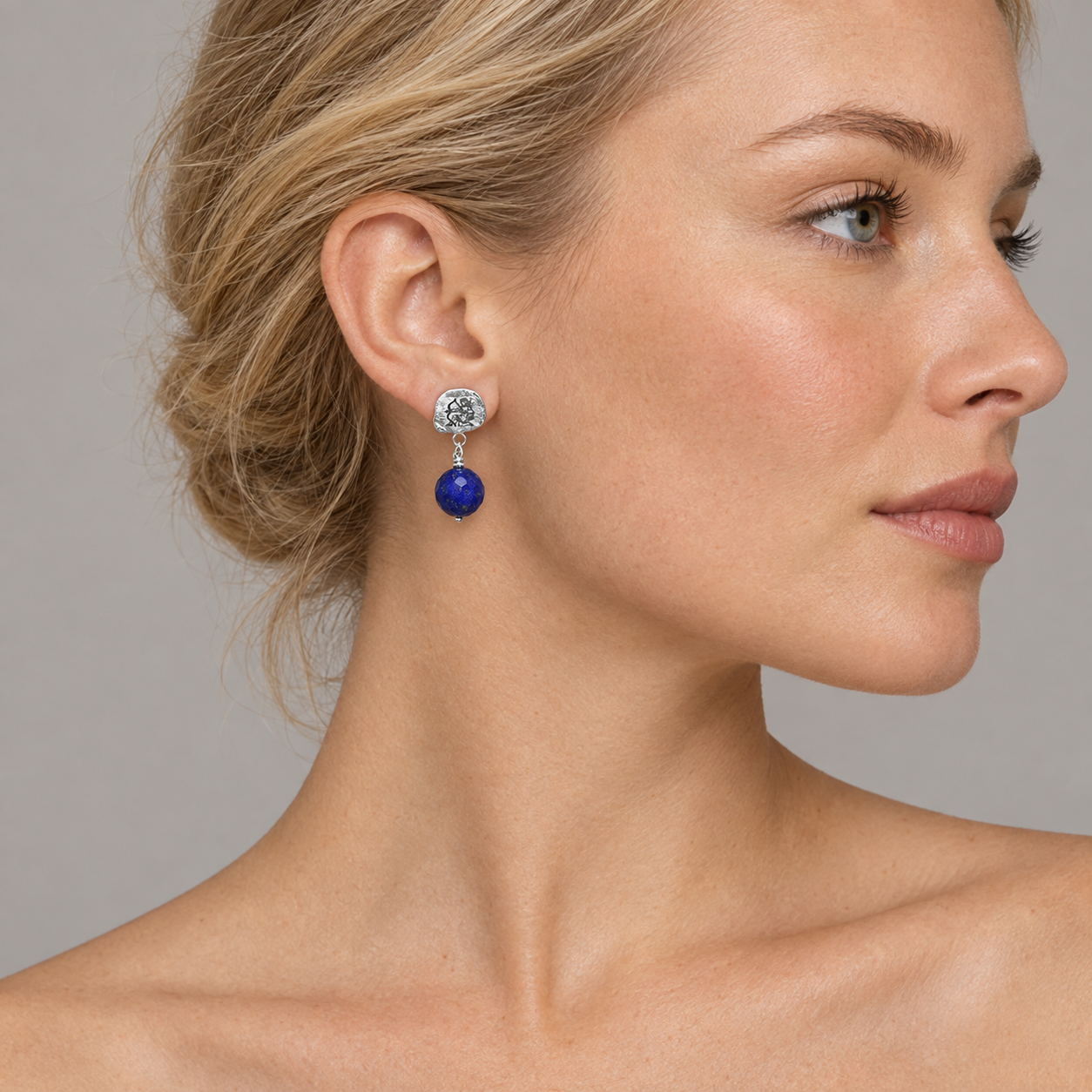 Model wearing the Lesunja Zodiac Sagittarius Gold Stud Earrings