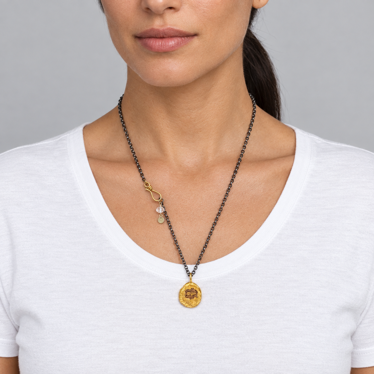 Model wearing the Lesunja Zodiac Pisces Silver Necklace Yellow Gold Nugget Moonstone