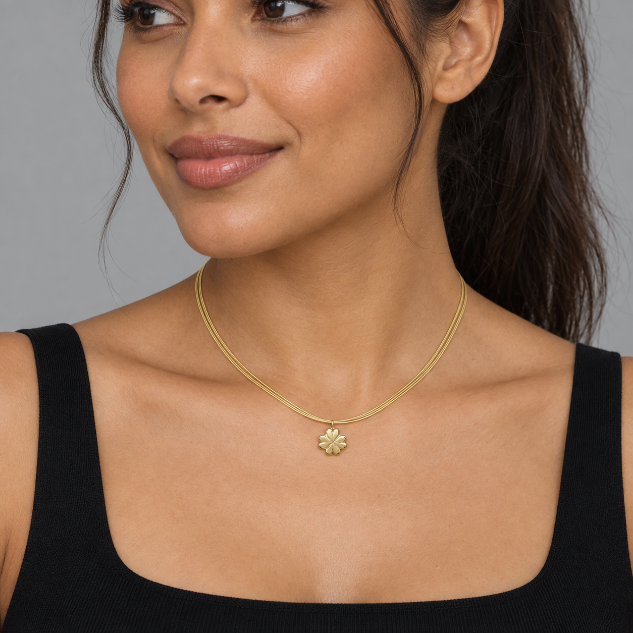 Model wearing the Lesunja Yellow Gold Clover Leaf Necklace