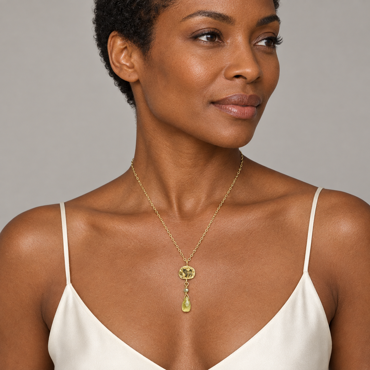 Model wearing the Lesunja Zodiac Taurus Gold Necklace